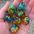 Set of colorful dice held in a hand