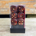 set of 12 six-sided dice in a clear plastic container