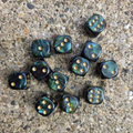 12 six-sided dice with a marbled green aesthetic