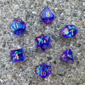 Set of colorful polyhedral dice on a concrete surface