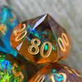 an orange percentile die with holographic foils