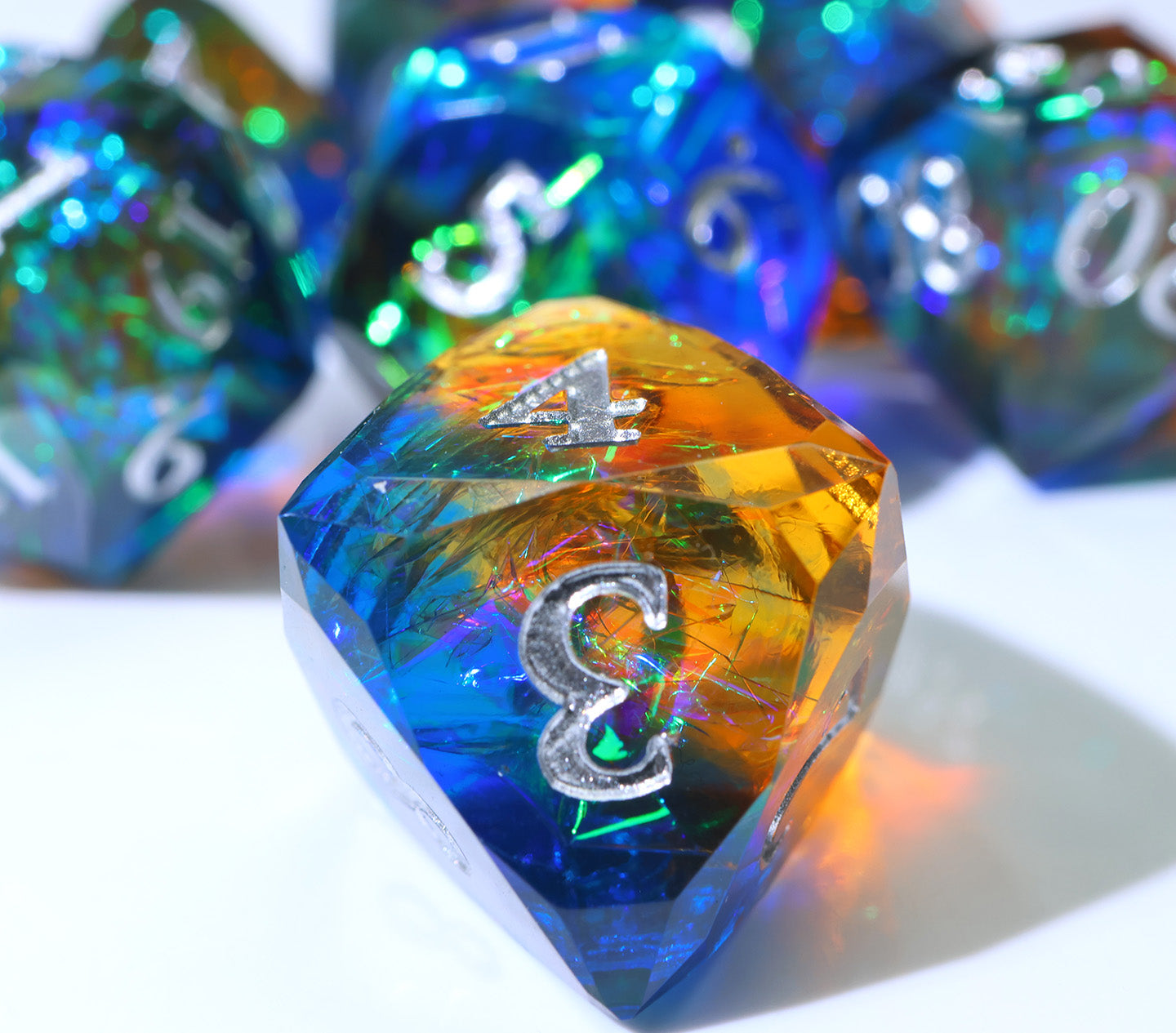 blue and red polyhedral dnd die with colorful paper inside