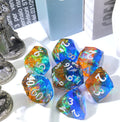 a set of colorful polyhedral dice with books and silver-colored gaming miniatures in the background