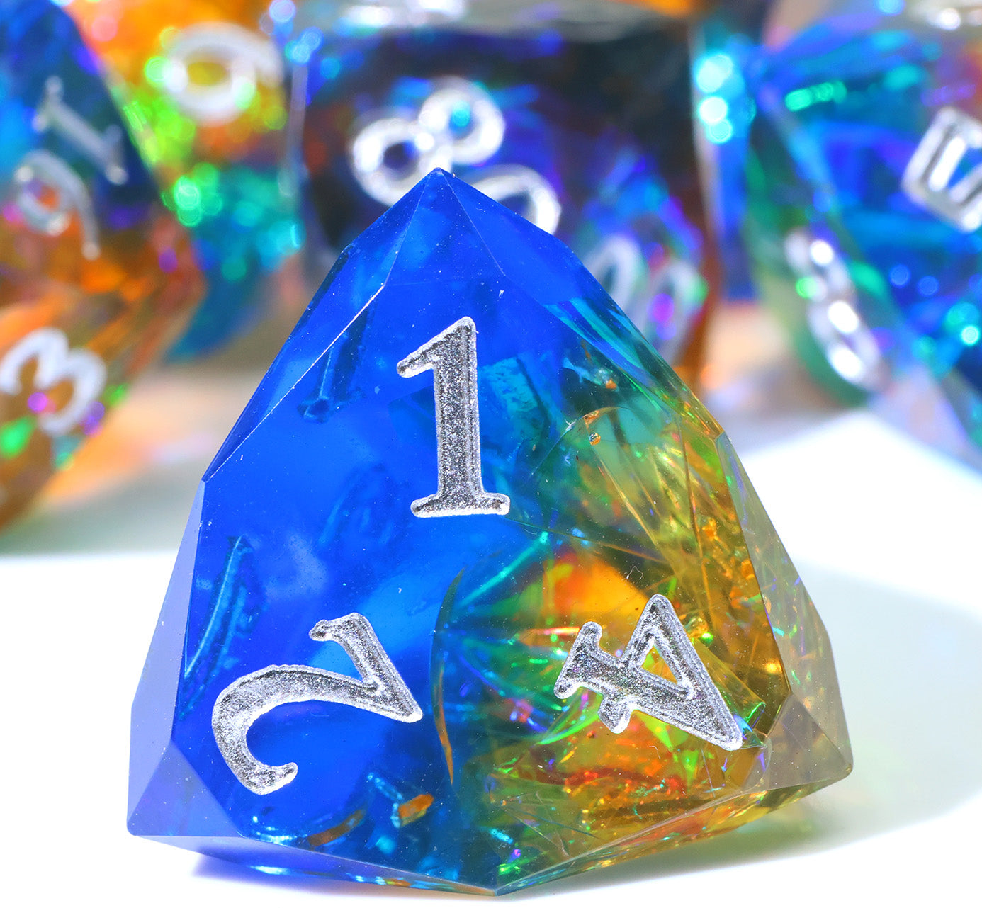 colorful four-sided, resin die with many faceted edges