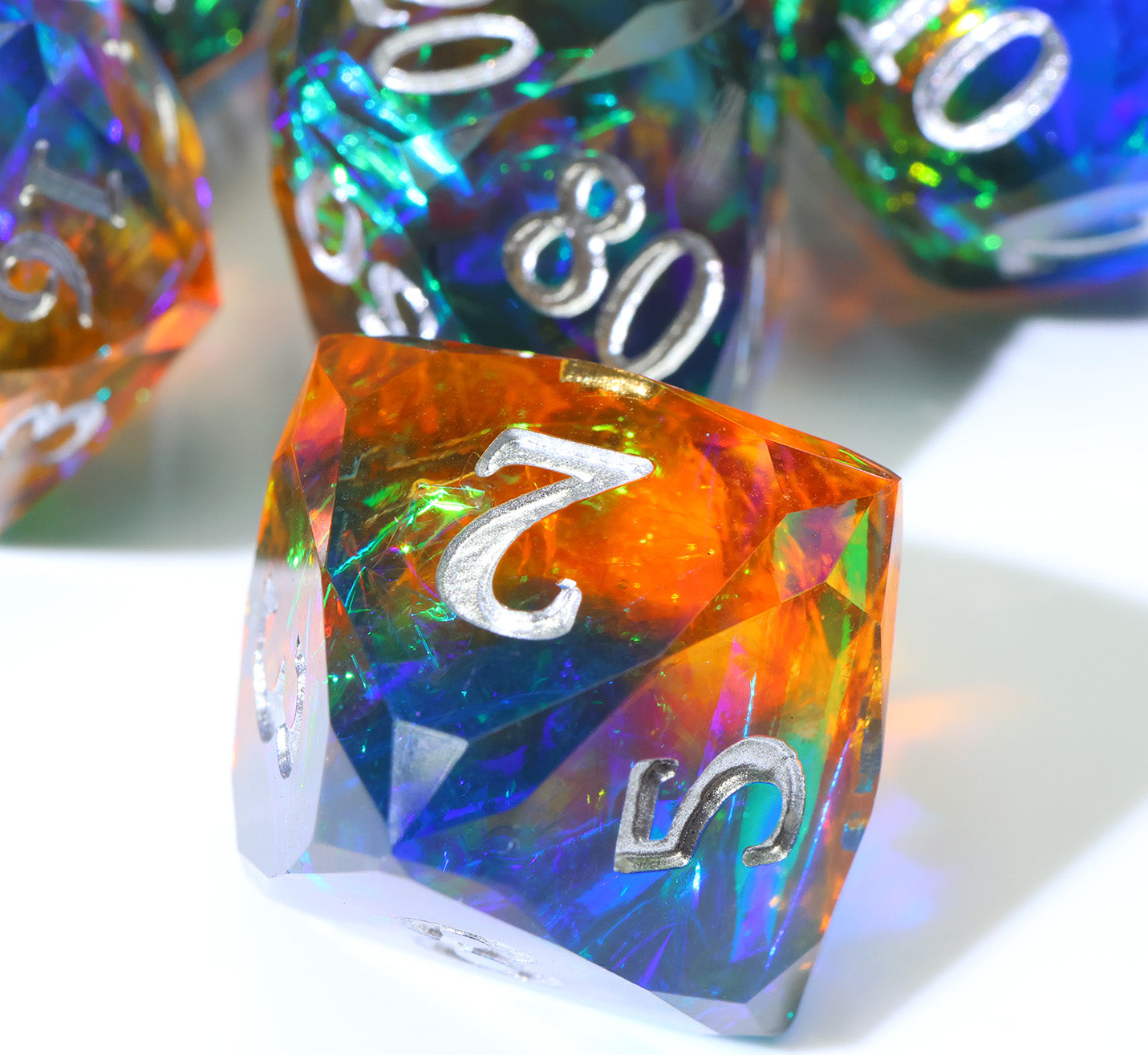 blue and orange eight-sided, resin die with faceted edges