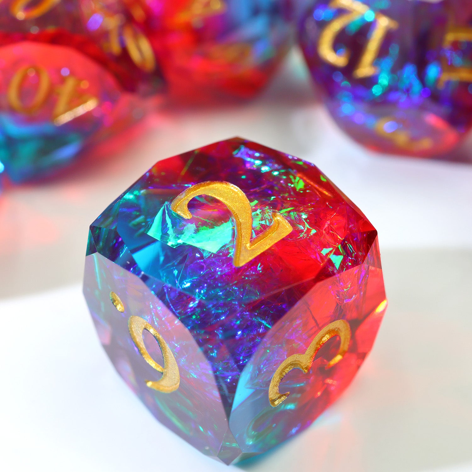 Close up of a brightly colored d6 with gold numbers