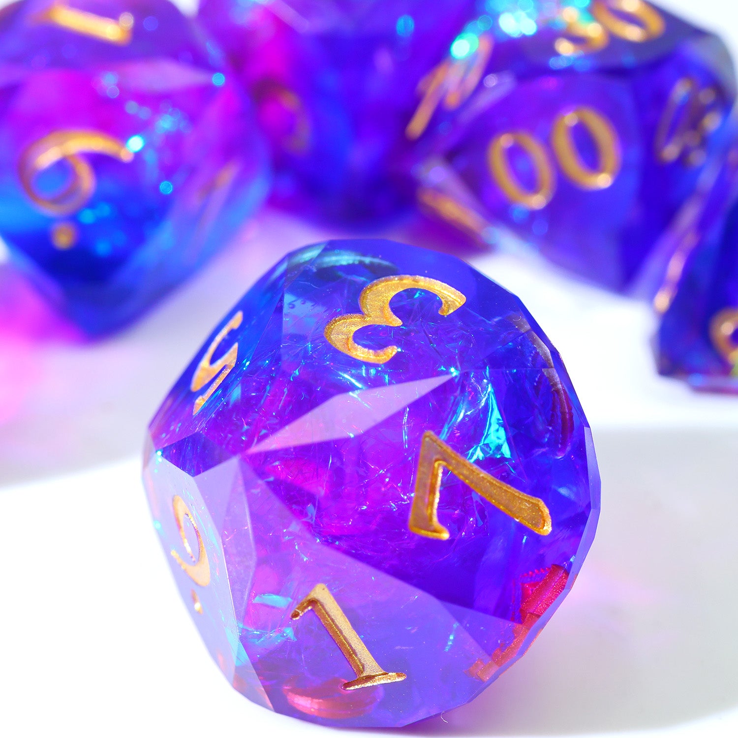 Multicolored polyhedral dice subtle fade from one color to the next 