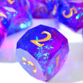 Semi-translucent purple polyhedral dice with gold numbers and holographic foils
